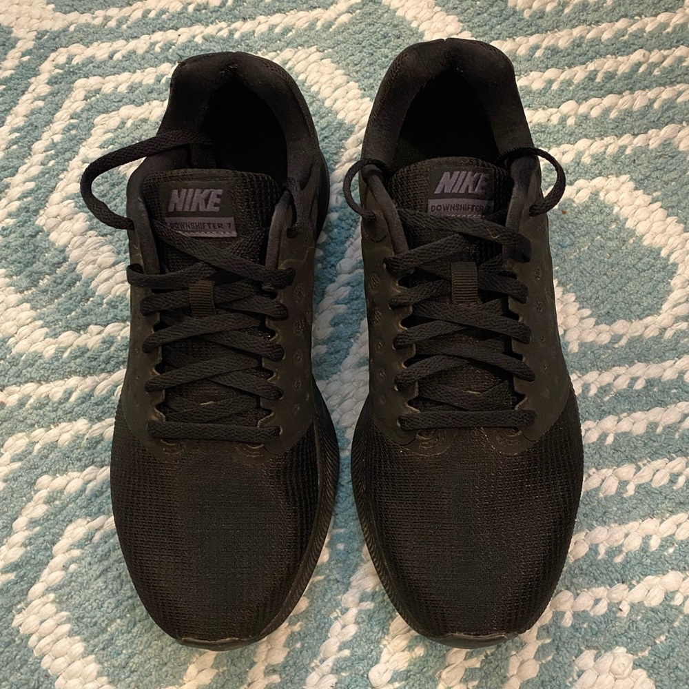 Women’s all black Nike Tennis Shoes